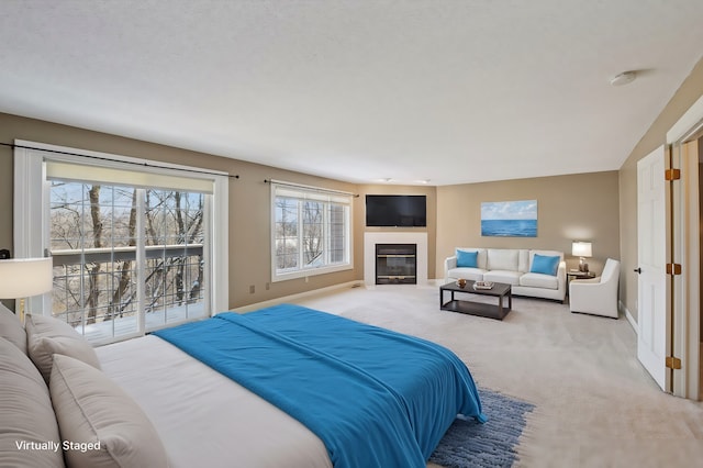 carpeted bedroom featuring access to exterior