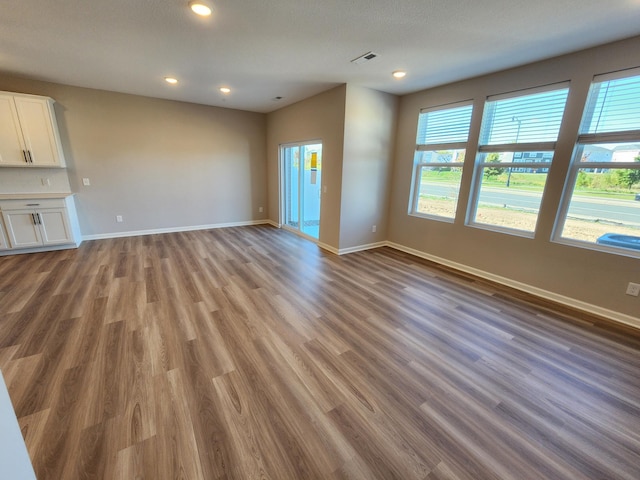 unfurnished living room with light hardwood / wood-style floors