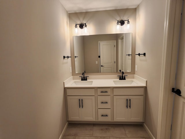 bathroom with tile patterned flooring and vanity