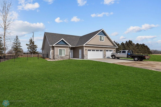 craftsman house featuring a garage and a front yard