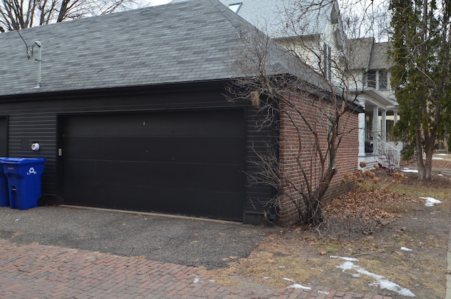 view of side of property featuring a garage