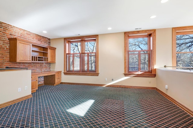 interior space with built in desk and carpet floors