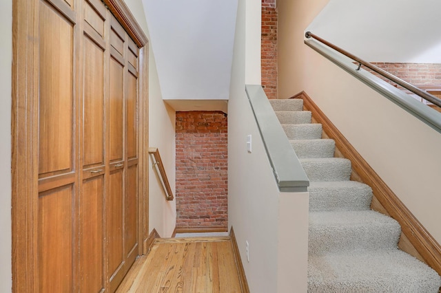 staircase featuring hardwood / wood-style flooring