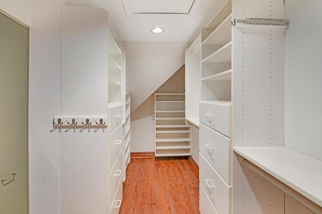 walk in closet featuring hardwood / wood-style floors