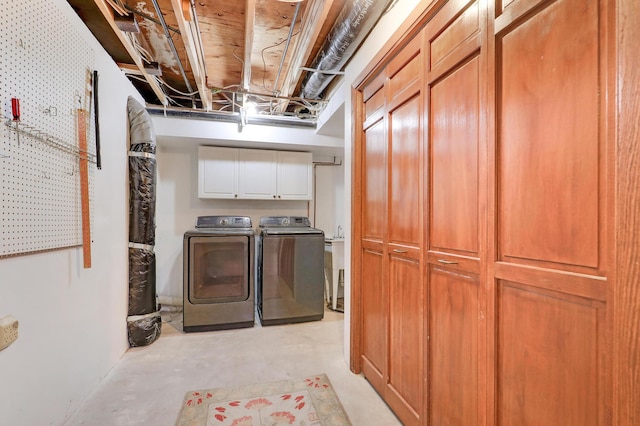 laundry area featuring cabinets and washing machine and clothes dryer