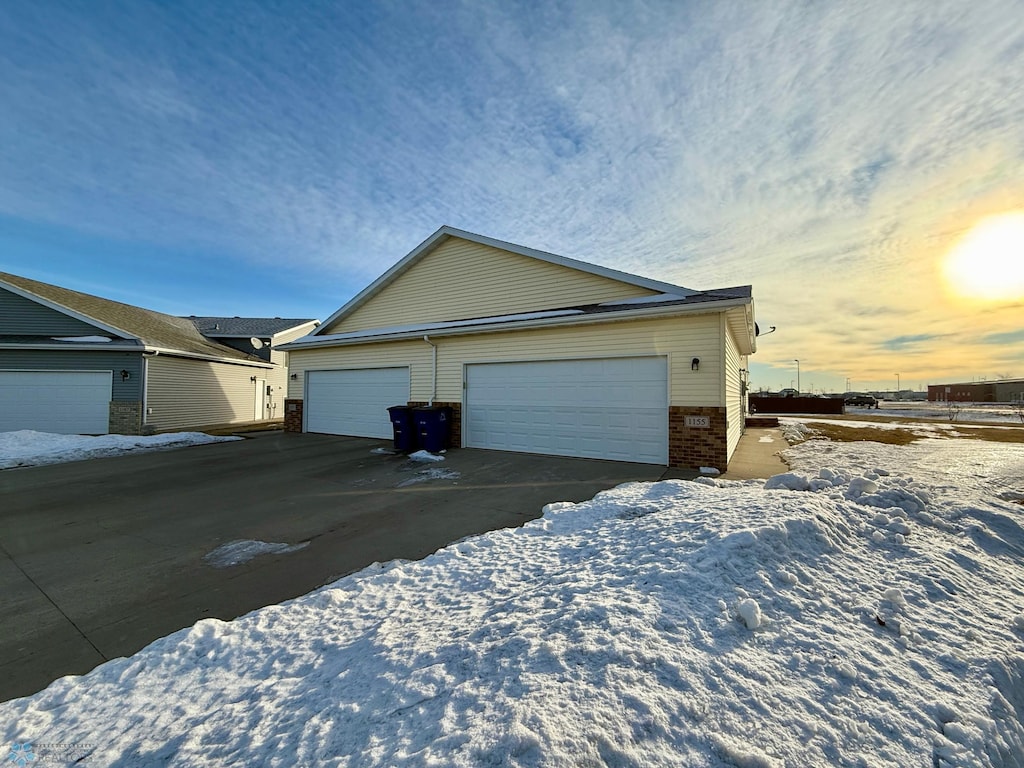 property exterior at dusk with a garage