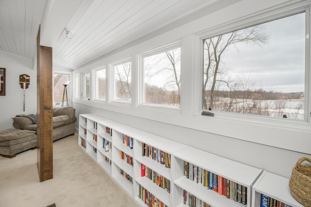 sunroom featuring wood ceiling and lofted ceiling