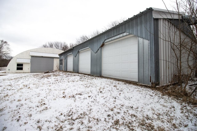 view of snow covered garage