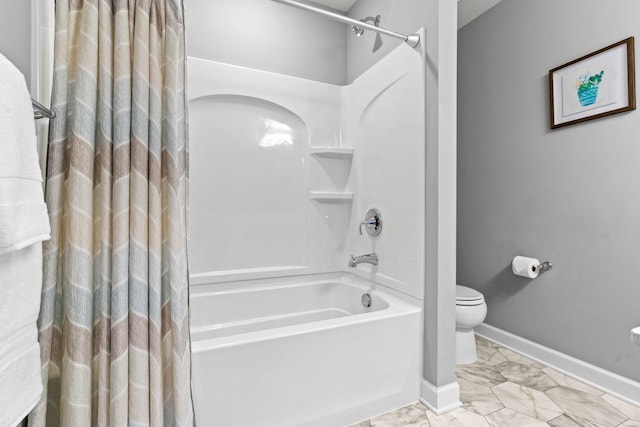 full bath with marble finish floor, toilet, baseboards, and shower / bathtub combination with curtain