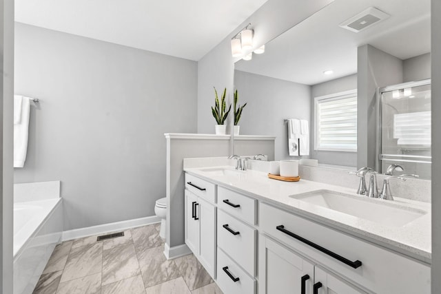 bathroom with a sink, visible vents, and toilet