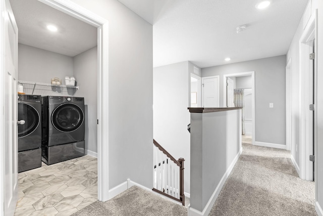 washroom with washer and dryer, recessed lighting, carpet flooring, baseboards, and laundry area