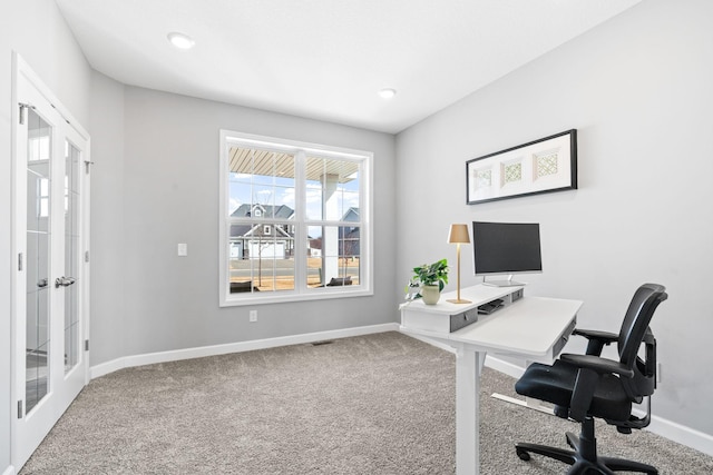 home office with visible vents, french doors, baseboards, and carpet floors