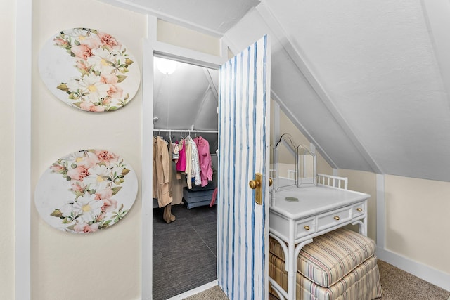 laundry room featuring carpet flooring and baseboards