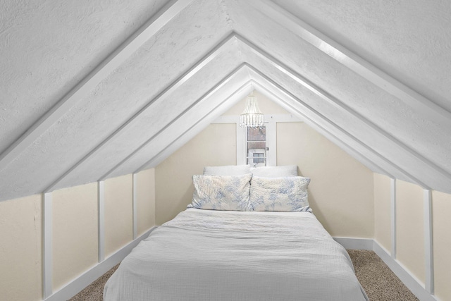 bedroom with lofted ceiling and carpet