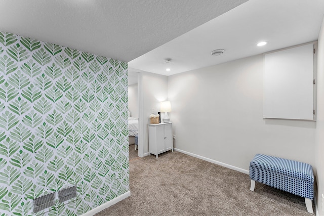 bedroom with recessed lighting, baseboards, an accent wall, and carpet flooring