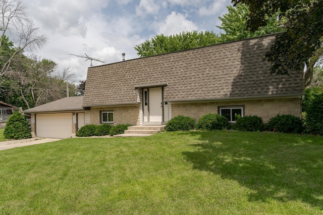 view of front of house with a front lawn and a garage