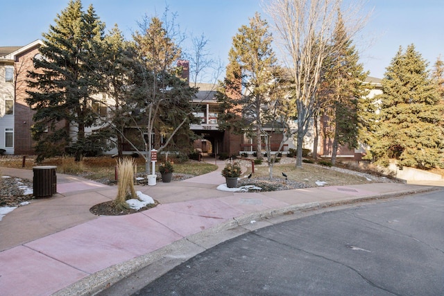 view of property hidden behind natural elements