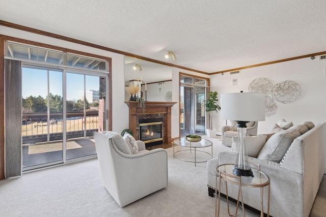 living room featuring a premium fireplace, ornamental molding, and light carpet