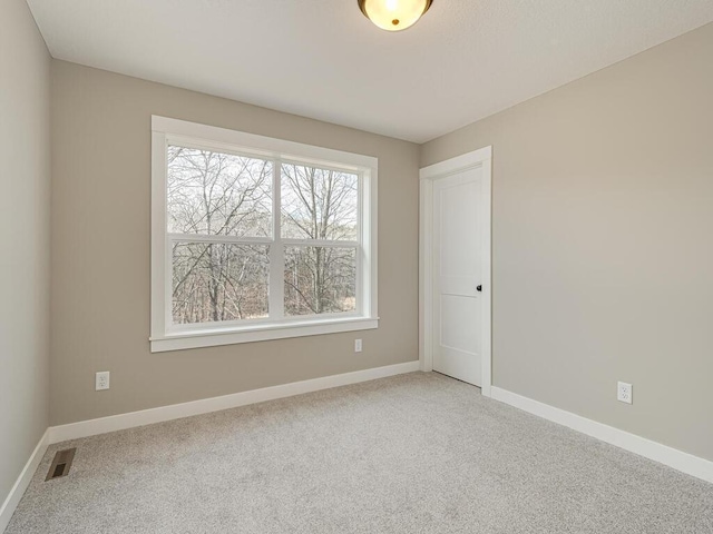 view of carpeted spare room