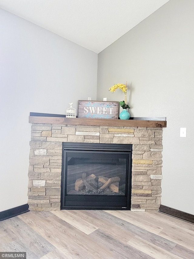 interior details with a fireplace and hardwood / wood-style flooring