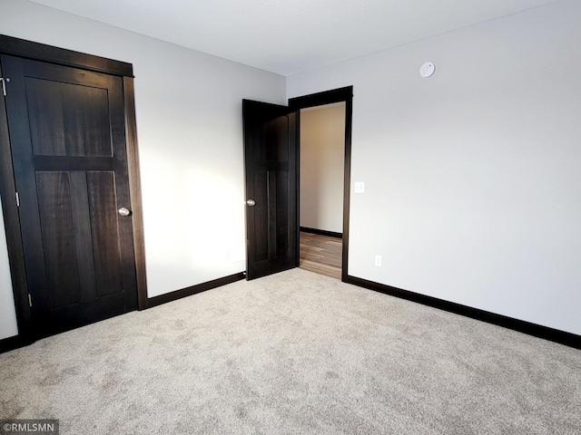 unfurnished bedroom with carpet floors