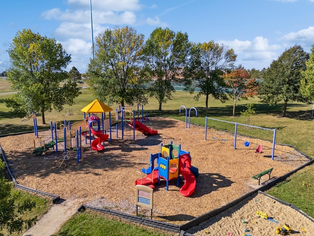 view of jungle gym featuring a lawn