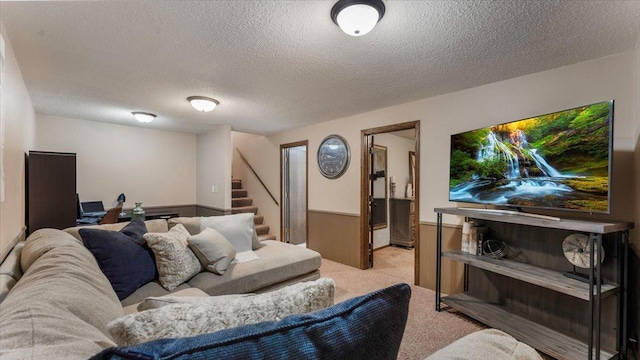 living room featuring a textured ceiling and light colored carpet