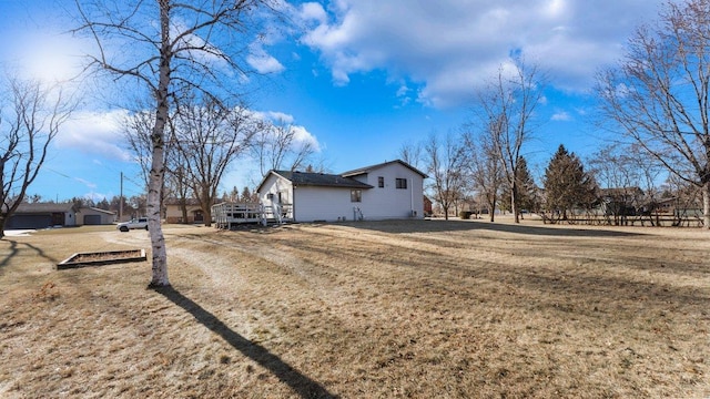 view of side of property with a lawn