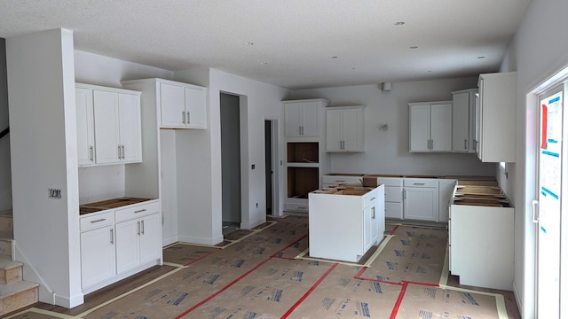 kitchen featuring a center island and white cabinets