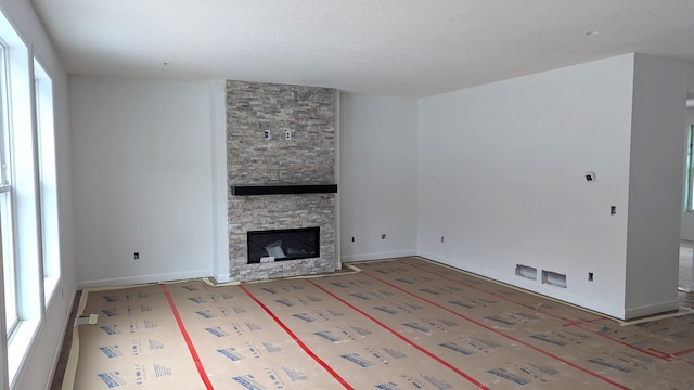 unfurnished living room with a fireplace