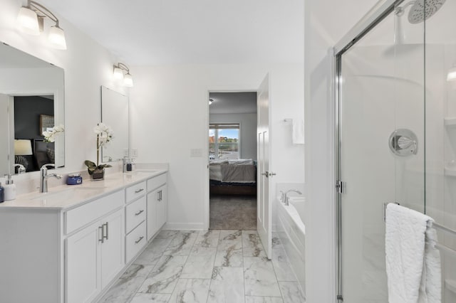 bathroom with a shower with door and vanity