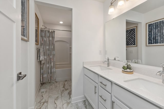 bathroom with shower / bath combo with shower curtain and vanity