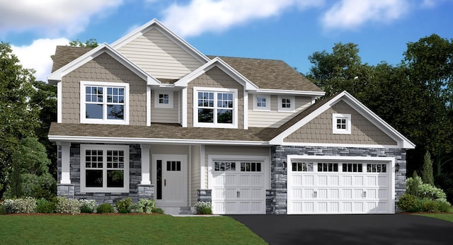 craftsman inspired home featuring a front lawn and a garage