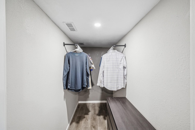 walk in closet featuring hardwood / wood-style flooring