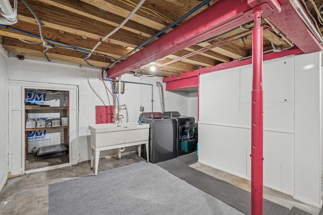 basement featuring sink and washing machine and clothes dryer