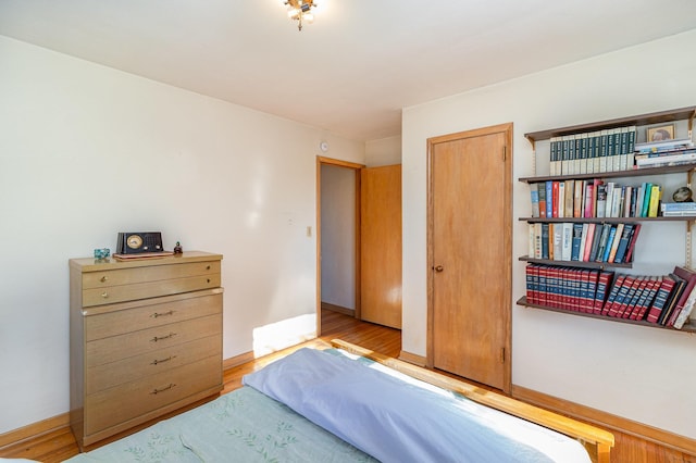 bedroom with a closet and light wood-type flooring