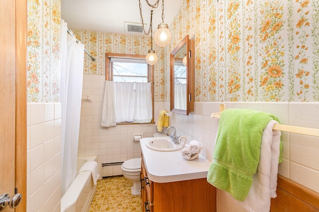 full bathroom featuring a baseboard radiator, tile walls, shower / bath combination with curtain, vanity, and toilet