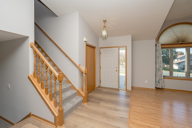 entrance foyer with a wealth of natural light and light hardwood / wood-style floors