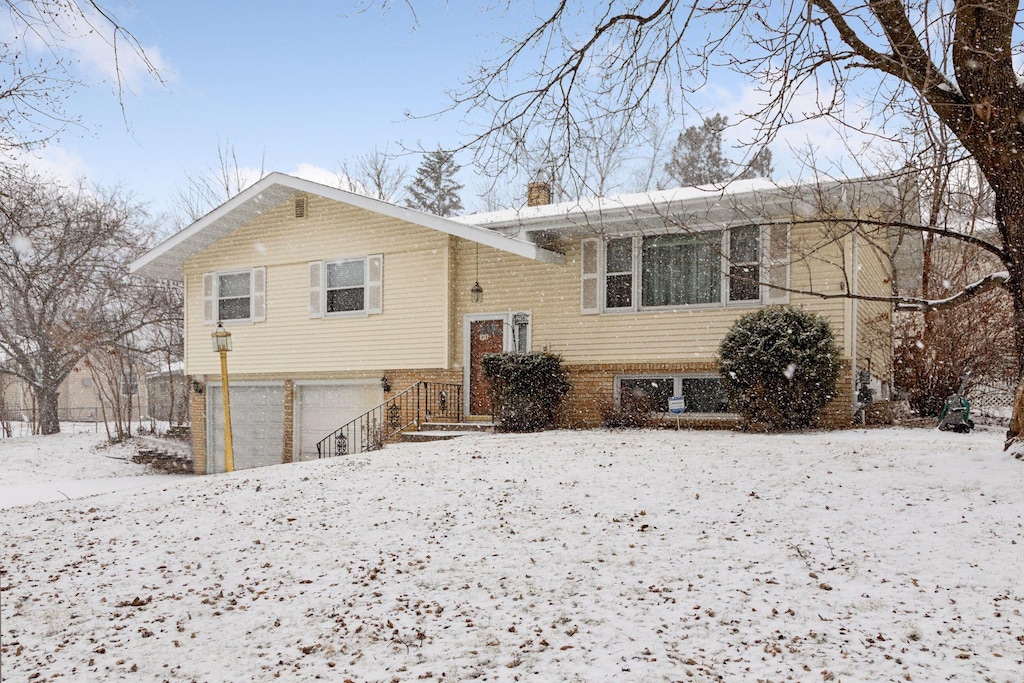 split foyer home featuring a garage