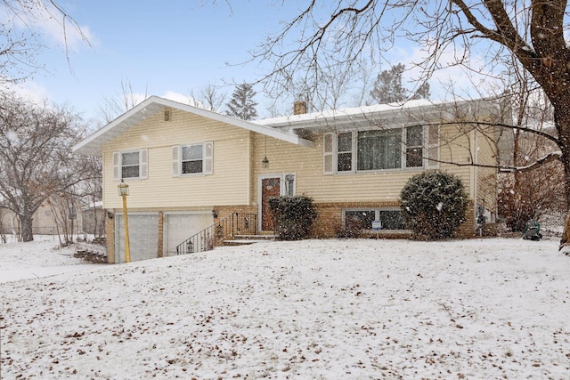 split foyer home featuring a garage