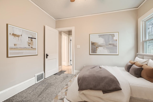 bedroom featuring ornamental molding and ceiling fan