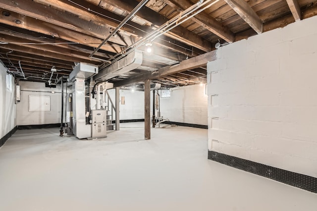 basement featuring heating unit