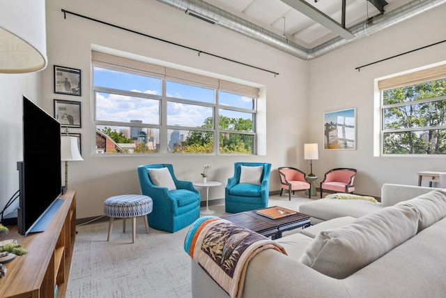 living room with a high ceiling