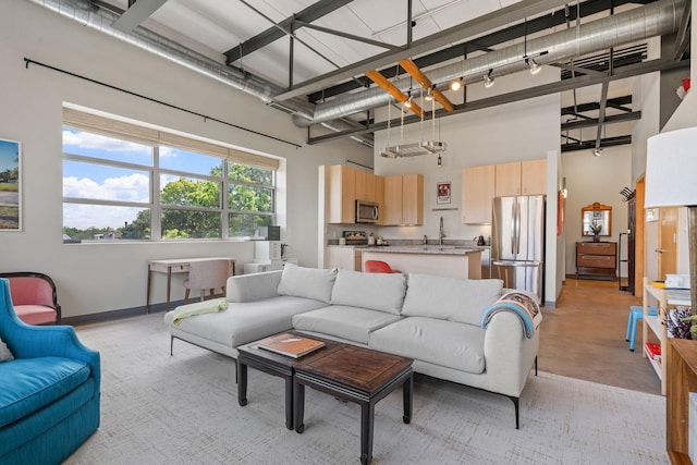 living room featuring a high ceiling