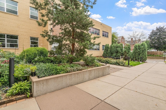 view of home's community with a patio area