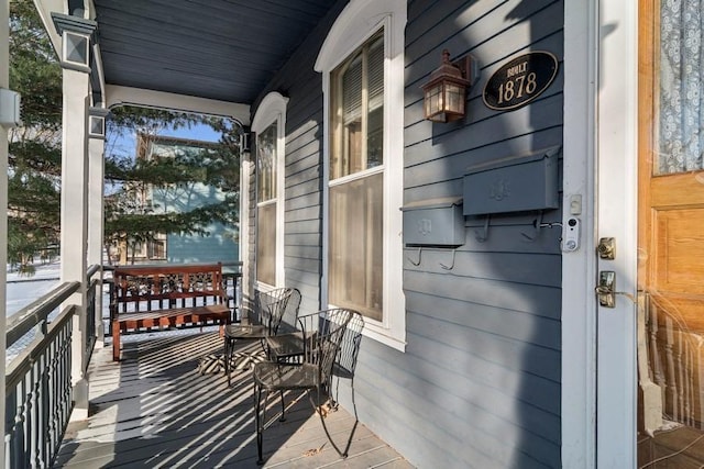 balcony featuring a porch