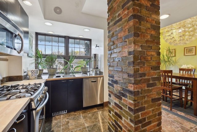 kitchen featuring stainless steel appliances and sink