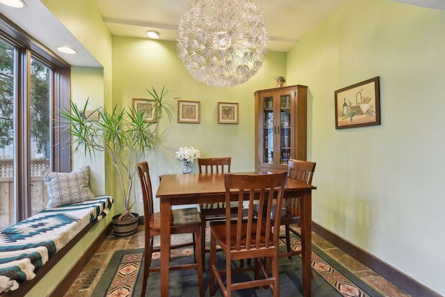 dining area with a notable chandelier