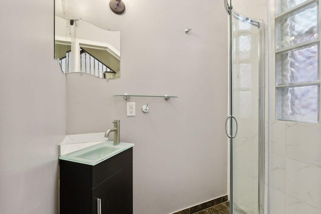 bathroom with vanity and an enclosed shower