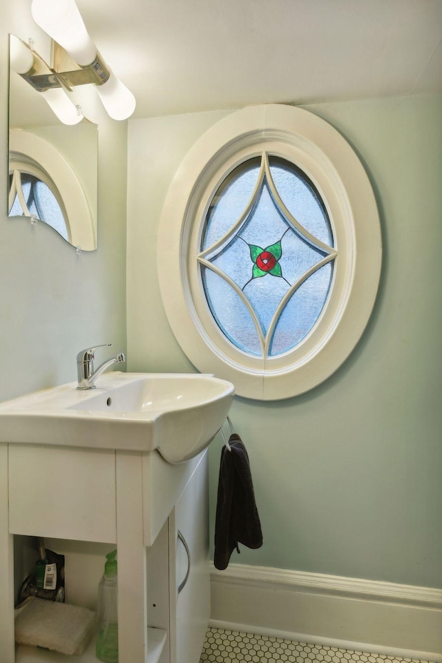 bathroom featuring tile patterned floors and vanity